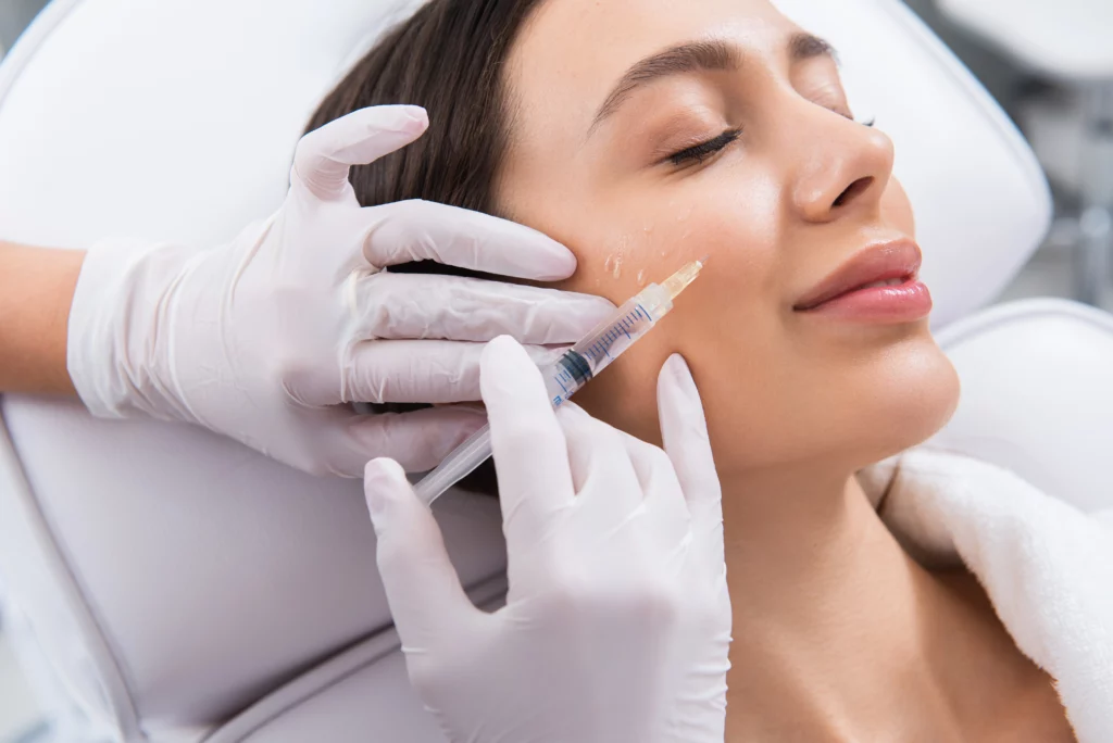 Woman receiving facial injections from a medical professional in Wakefield, MA | Infinite Beauty Med Spa